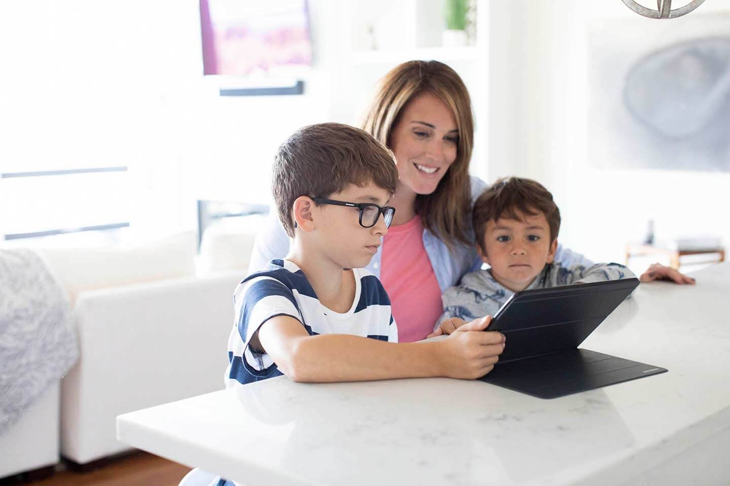 Mom and children with tablet