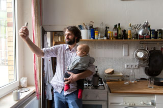 Man and kid taking selfie